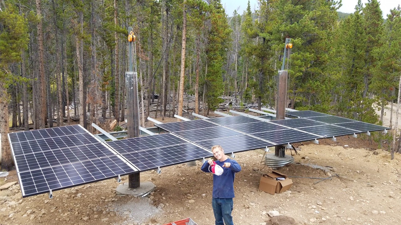solar installer in front of array in bellvue, colorado