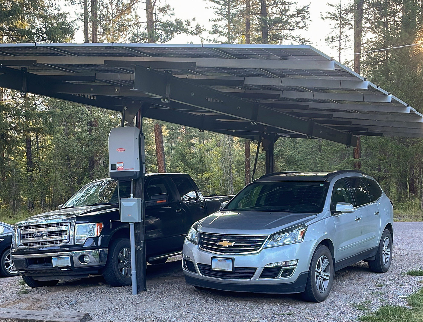 solar carport with two vehicles underneath