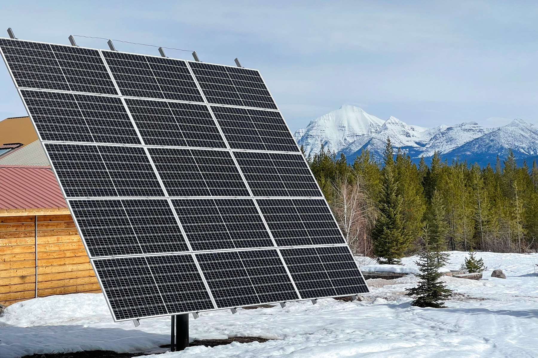 solar panels with glacier national park in backgound