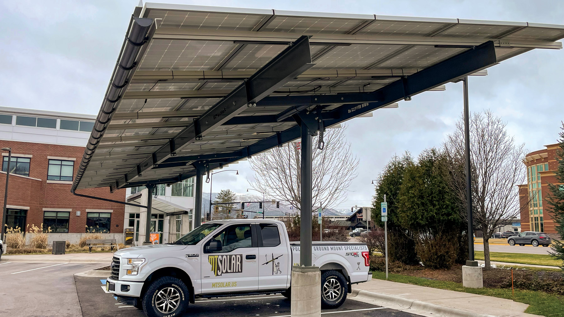 truck parked under solar carport