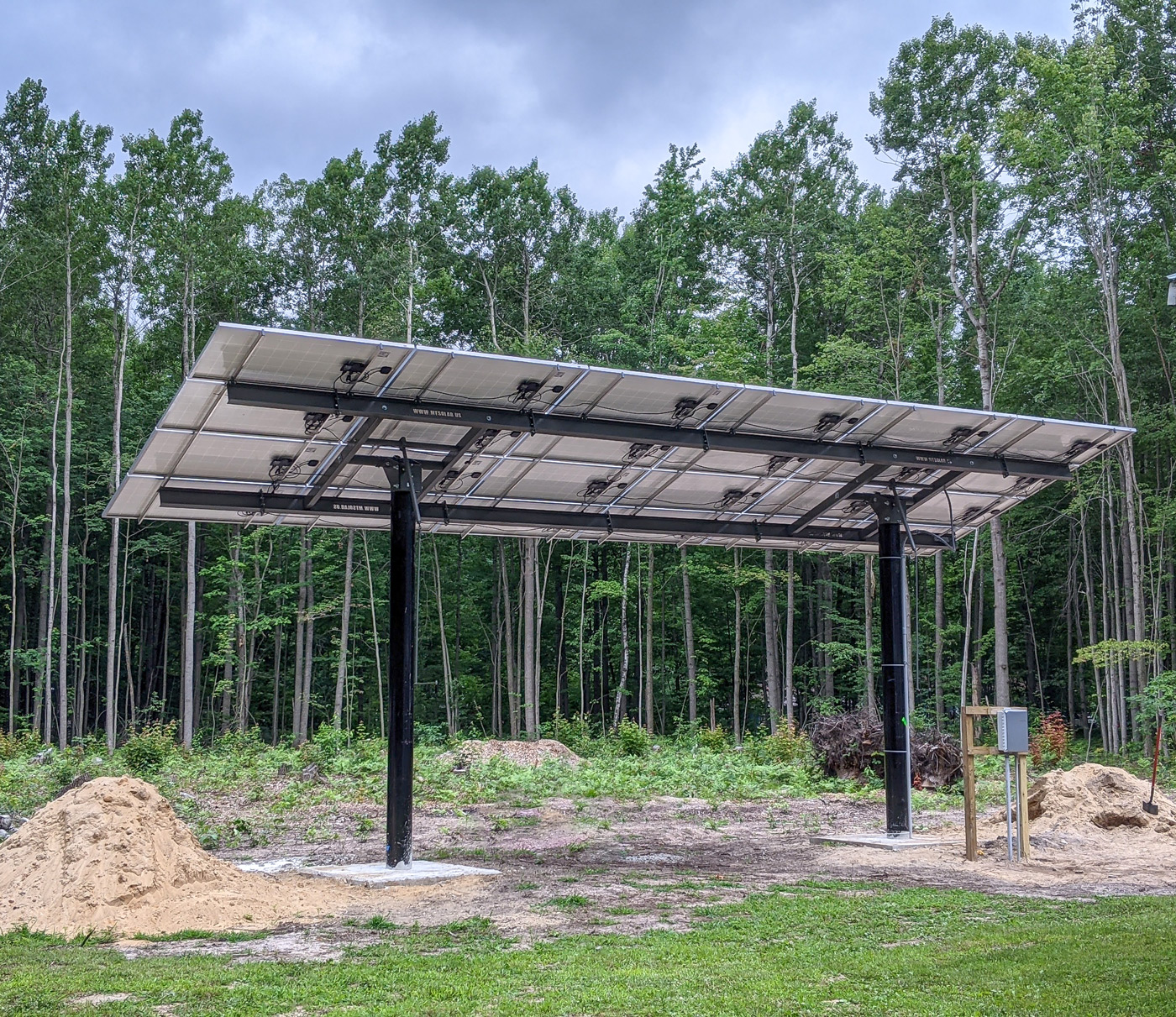 solar pole mount array with high ground clearance in forest setting