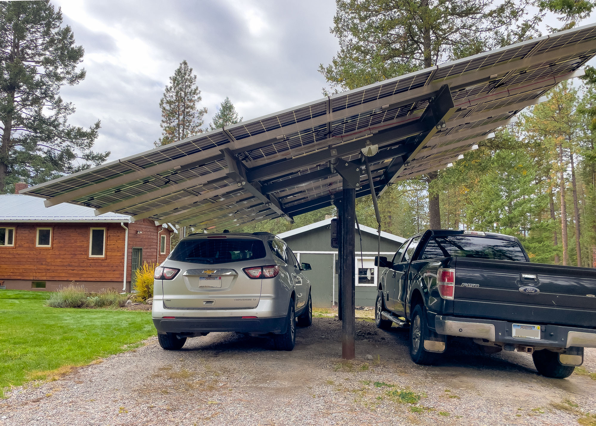 solar carport with two vehicles parked beneath