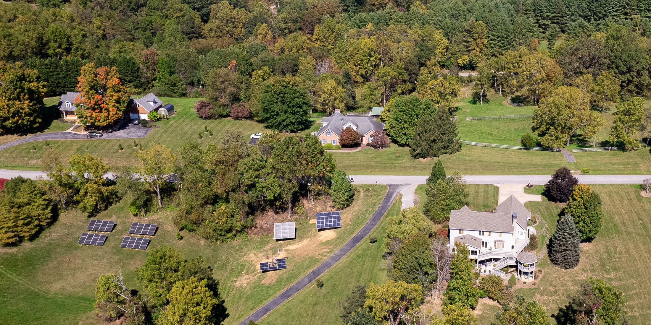 aerial image of ground mounted solar installs in a rural area