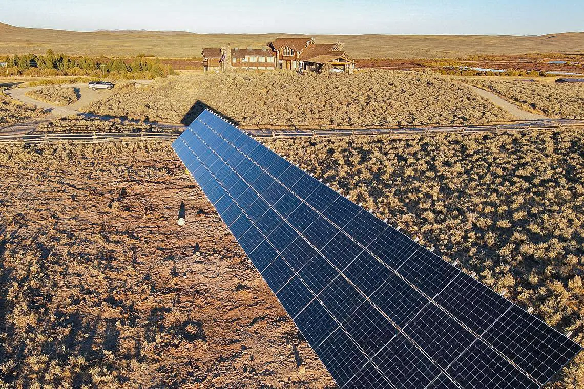 large solar array in field at residence in wyoming