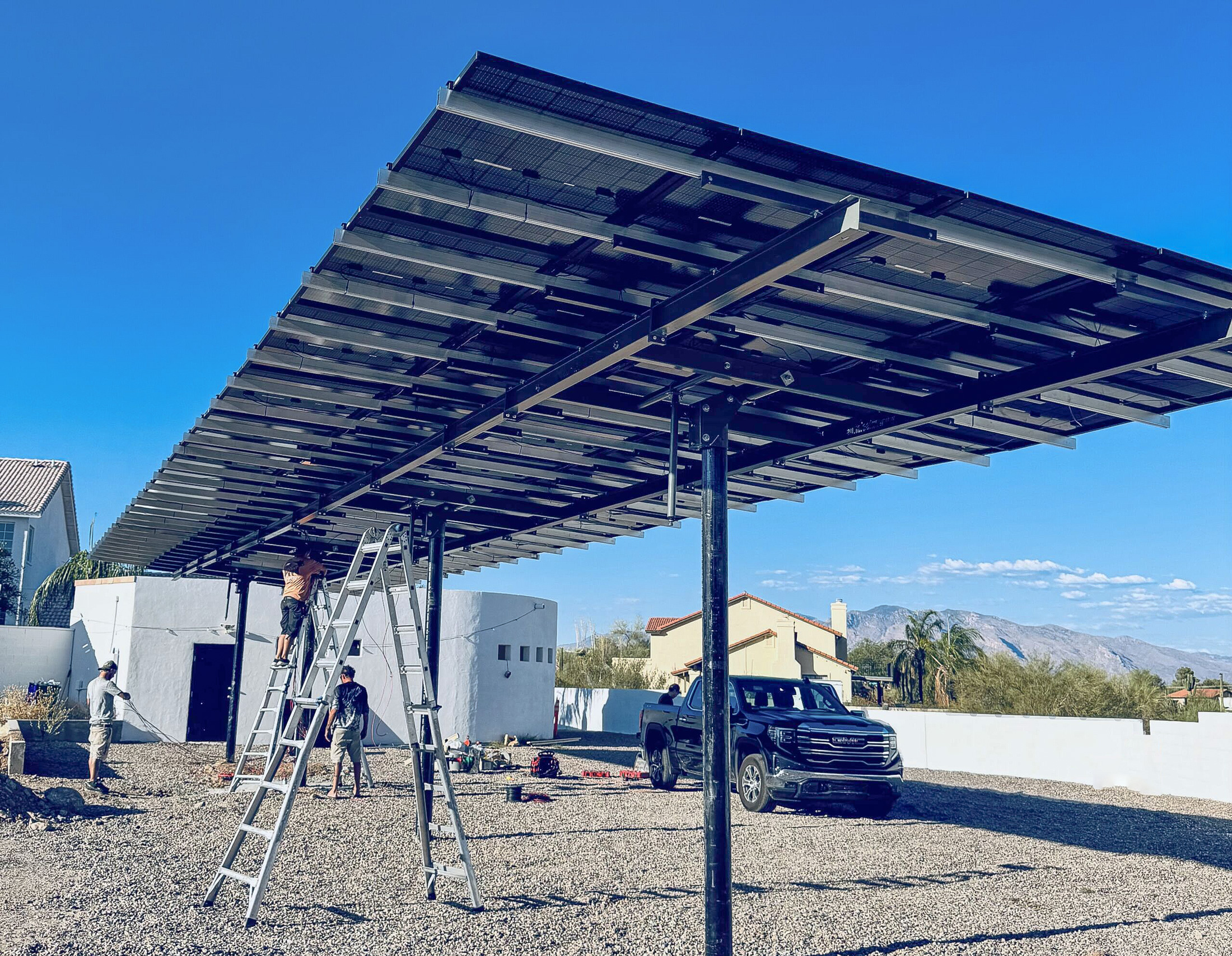 solar installers working under a carport in arizona