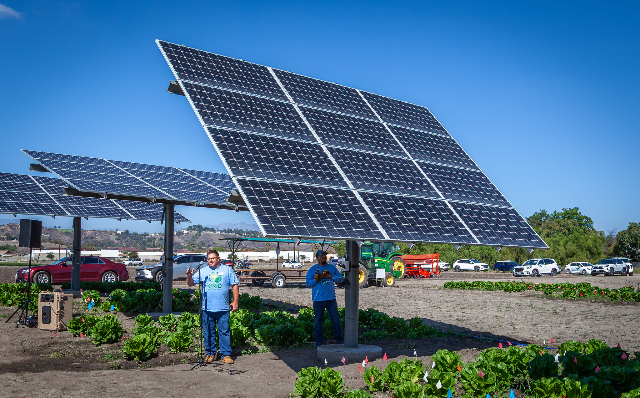Dan and Jose of GRID solar installers demonstrate tilt of pole mounts