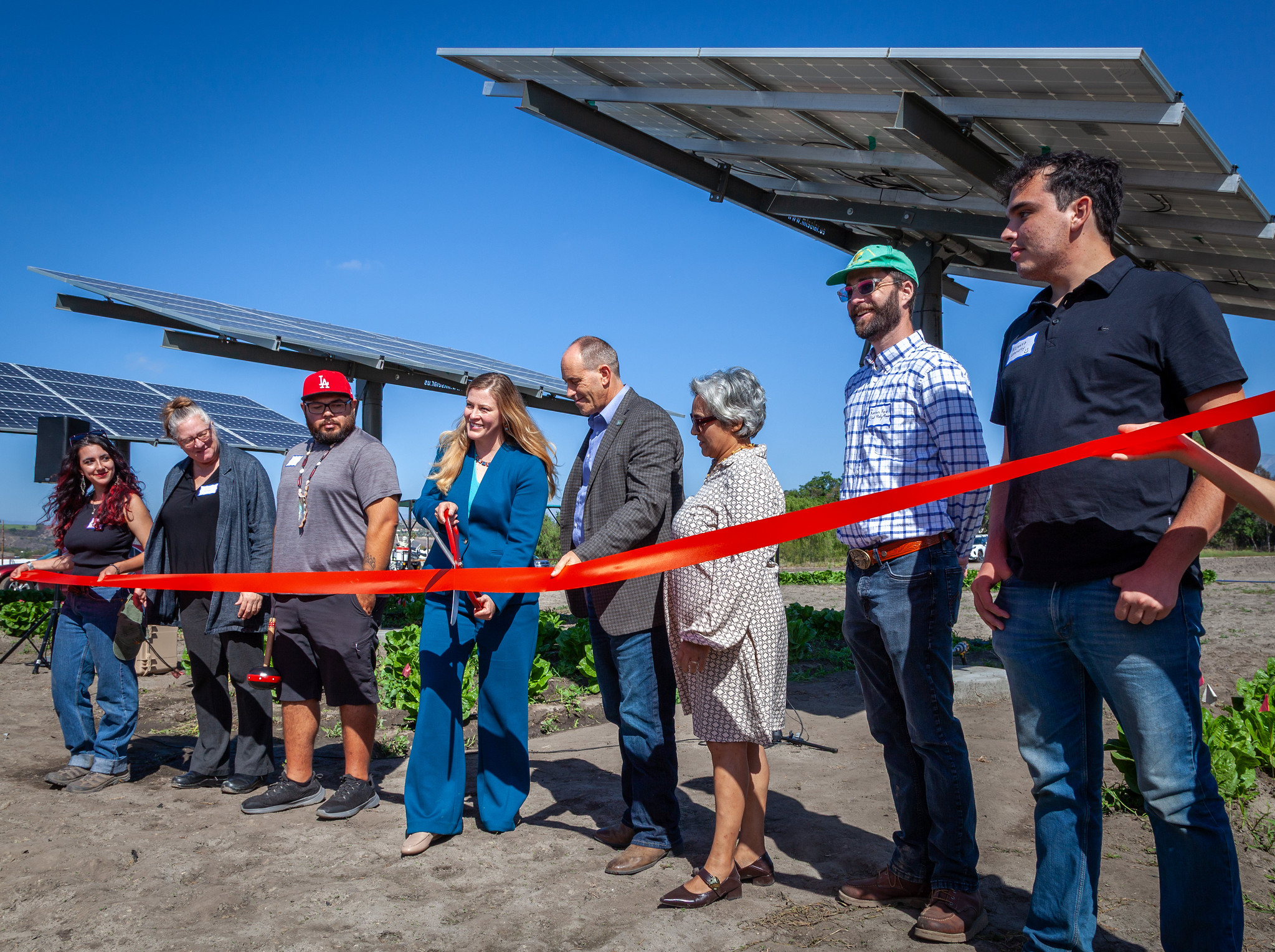 ribbon cutting at Spadra farm california agricultural deputy cuts ribbon at solar farm